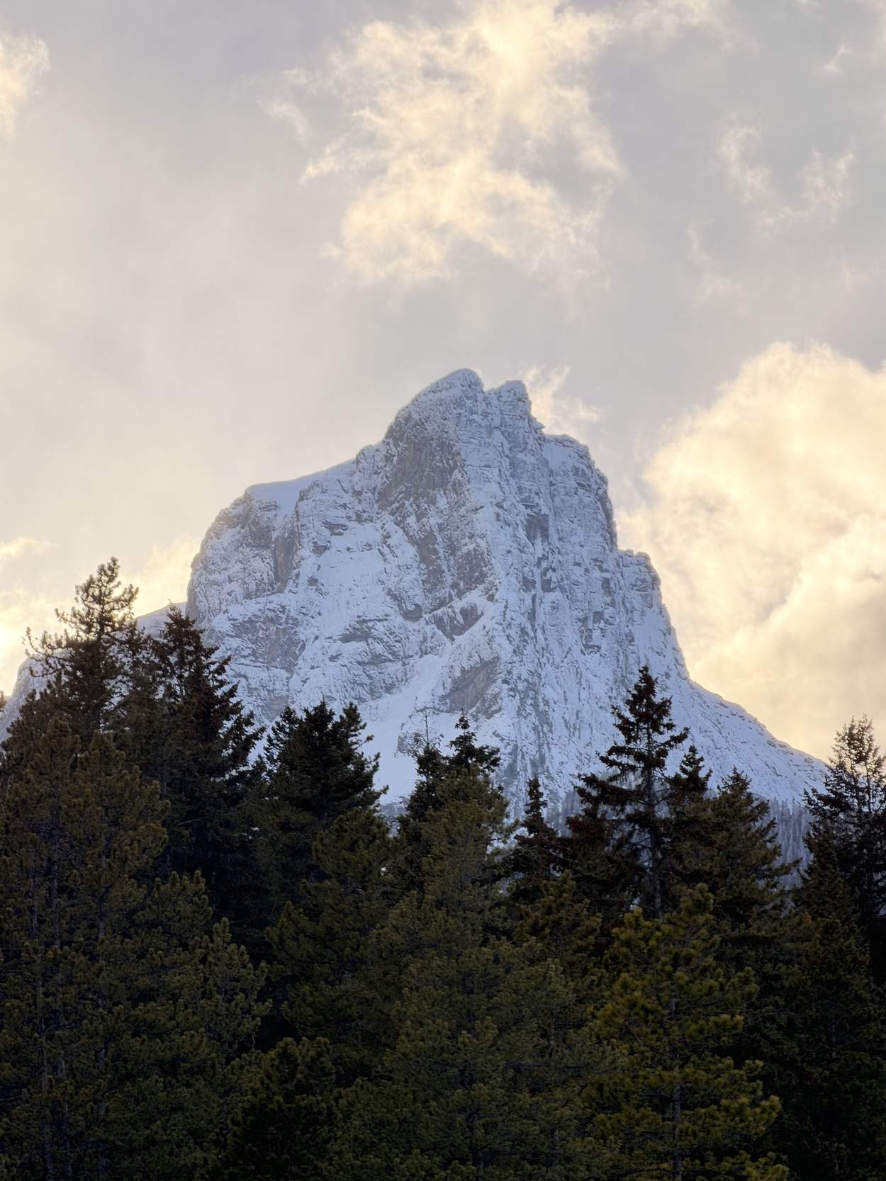 Snow-capped Three Sisters peak at golden hour